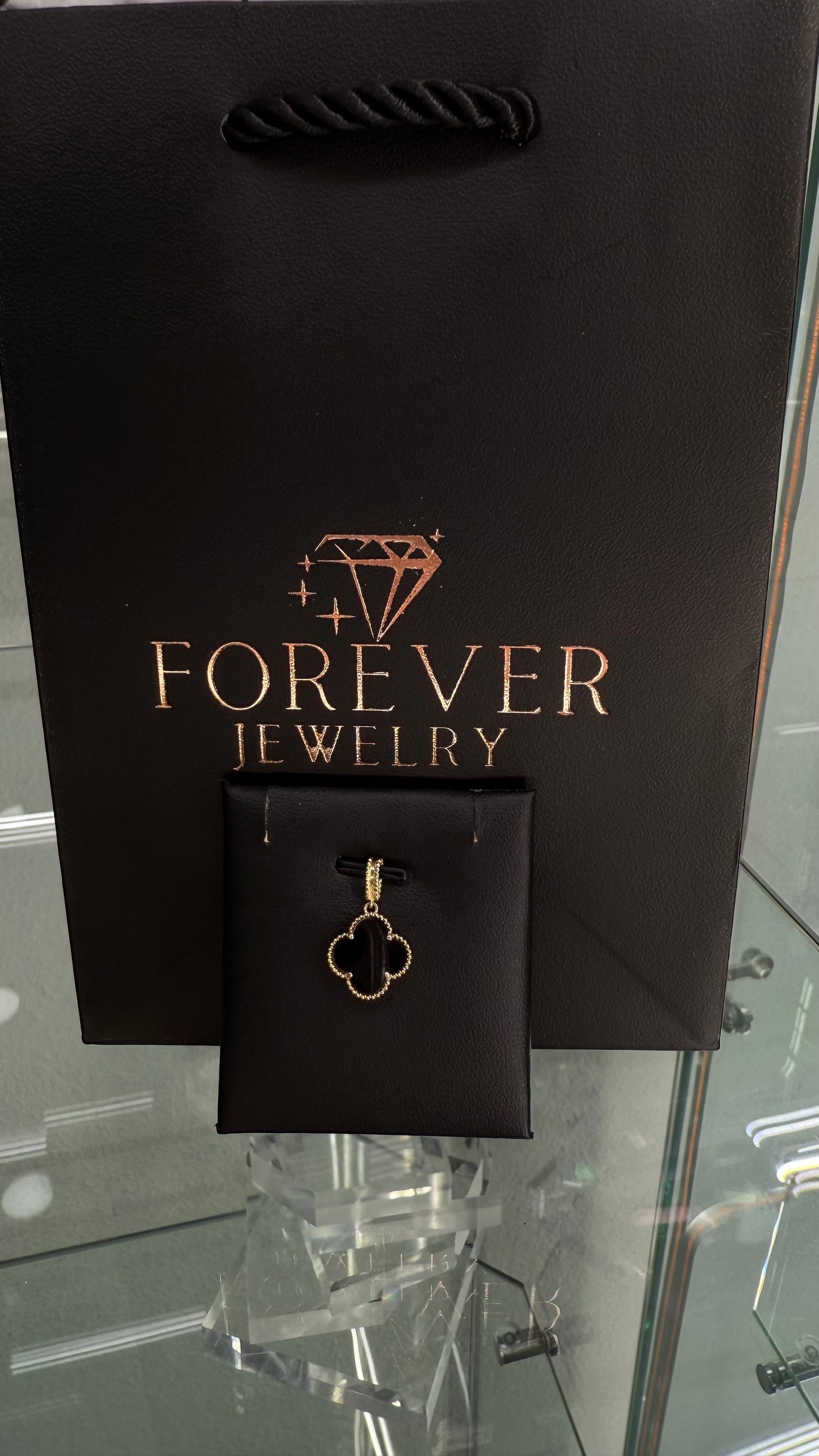 14KT GOLD BLACK FLOWER PENDANT