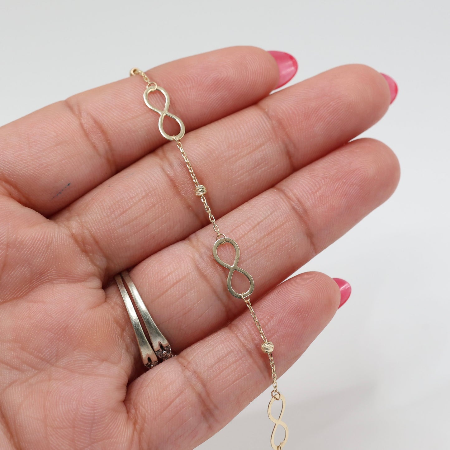14KT GOLD INFINITY BRACELET WITH DAINTY BALLS
