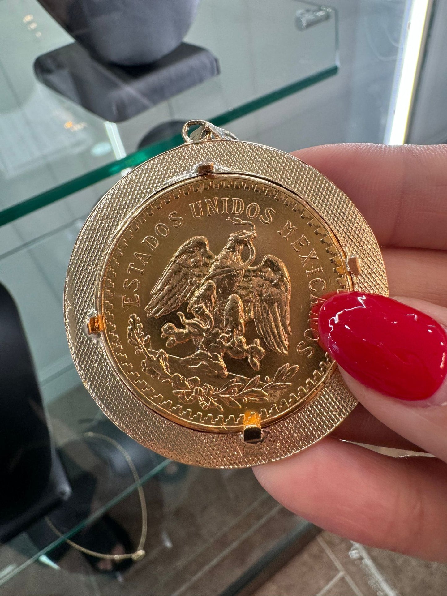 22KT GOLD CENTENARIO W/ A 14K GOLD BEZEL
