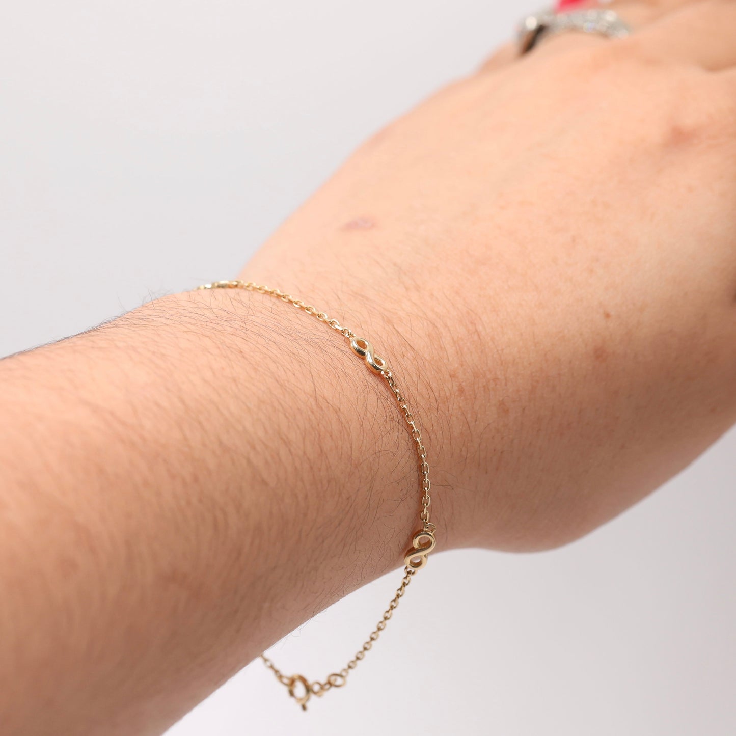 14KT GOLD 4 SMALL INFINITY BRACELET