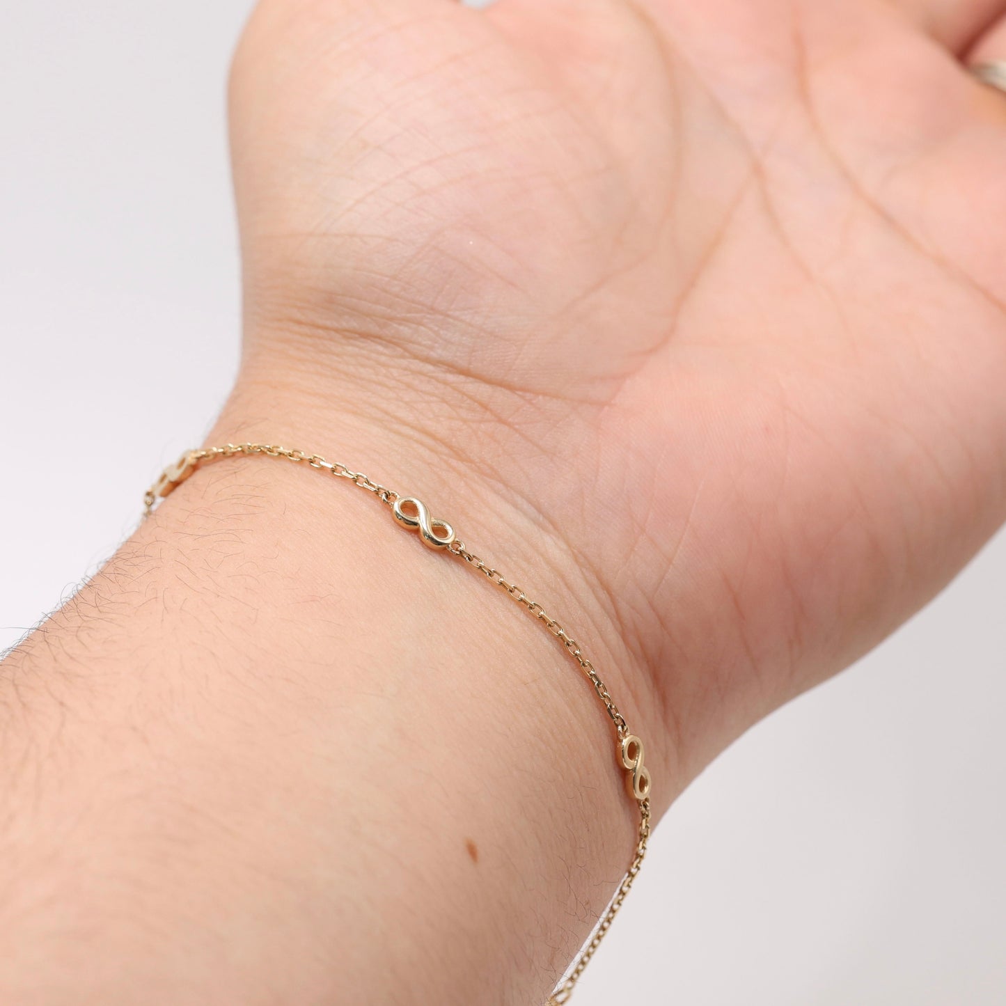 14KT GOLD 4 SMALL INFINITY BRACELET