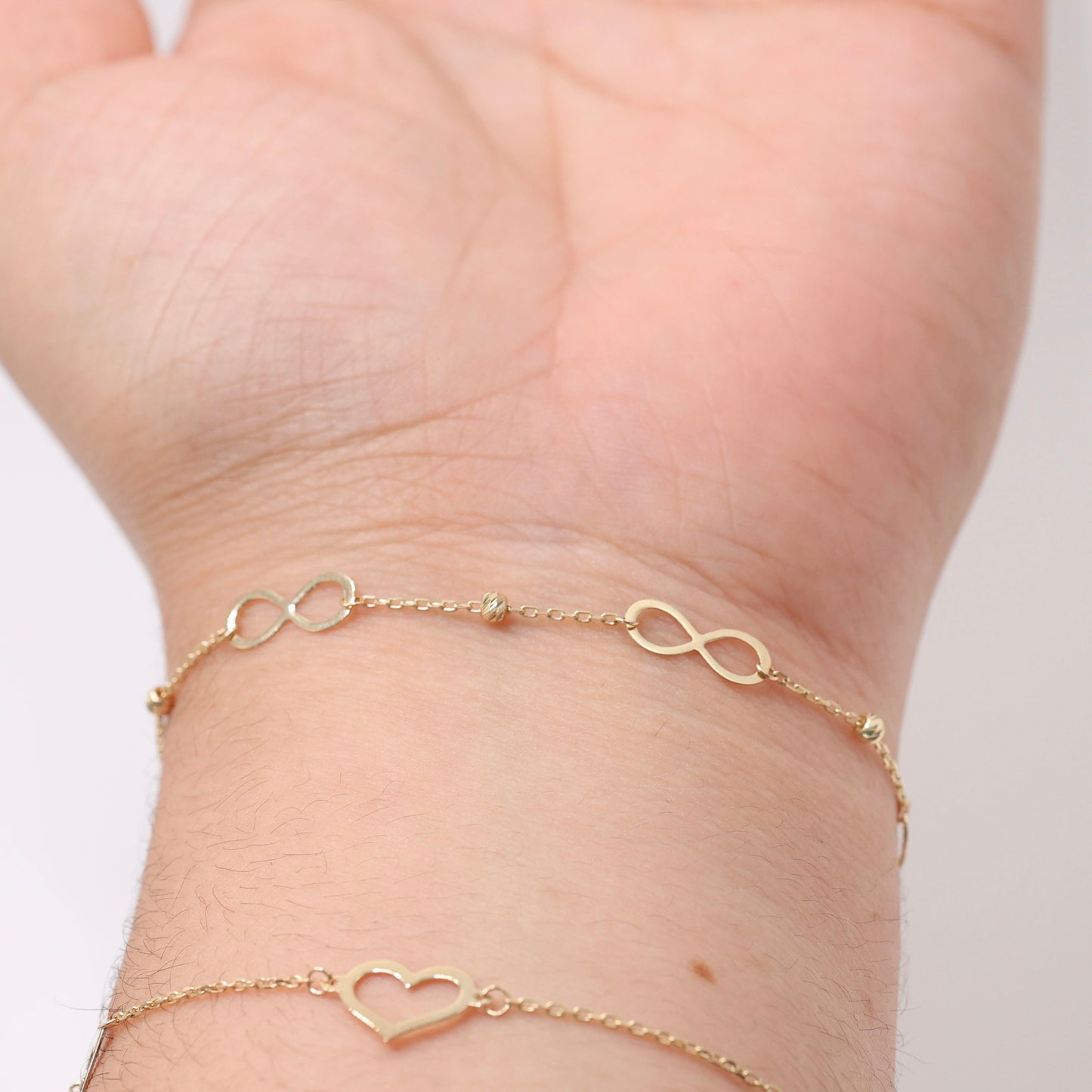 14KT GOLD INFINITY BRACELET WITH DAINTY BALLS