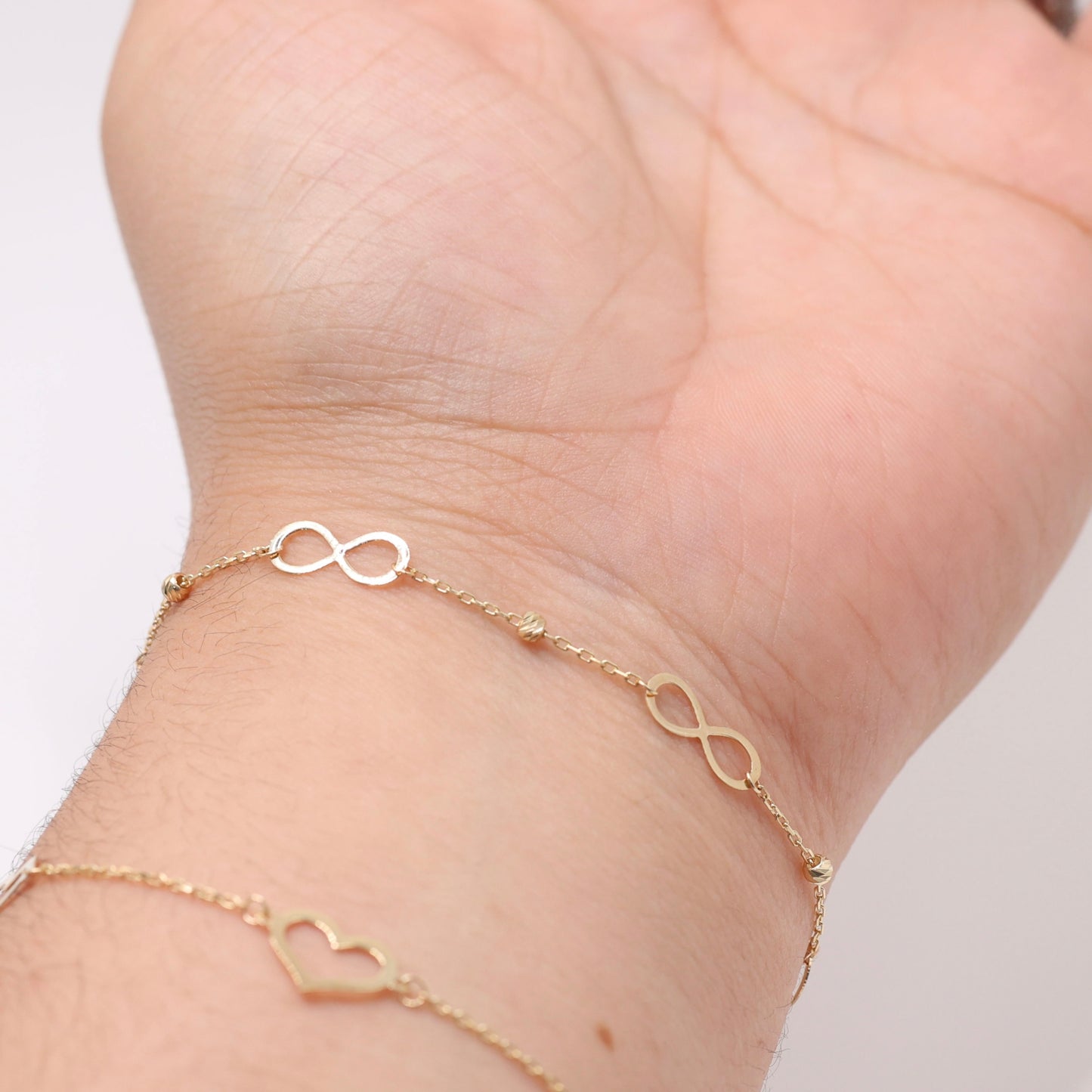 14KT GOLD INFINITY BRACELET WITH DAINTY BALLS