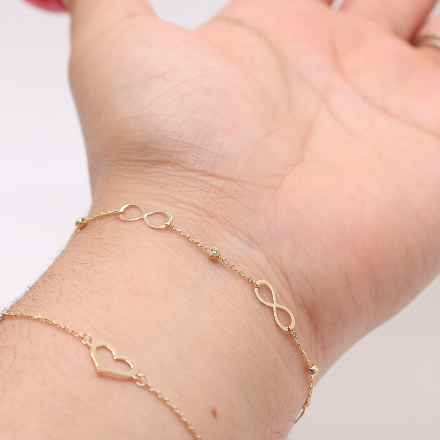 14KT GOLD INFINITY BRACELET WITH DAINTY BALLS