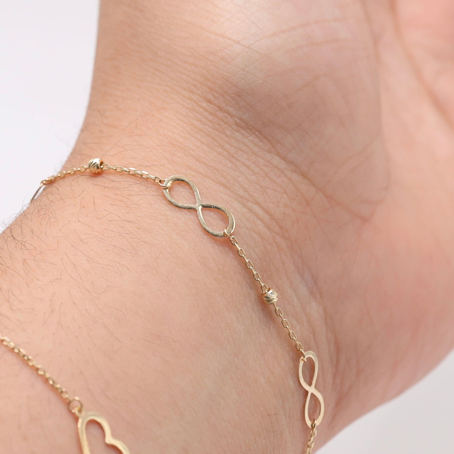 14KT GOLD INFINITY BRACELET WITH DAINTY BALLS