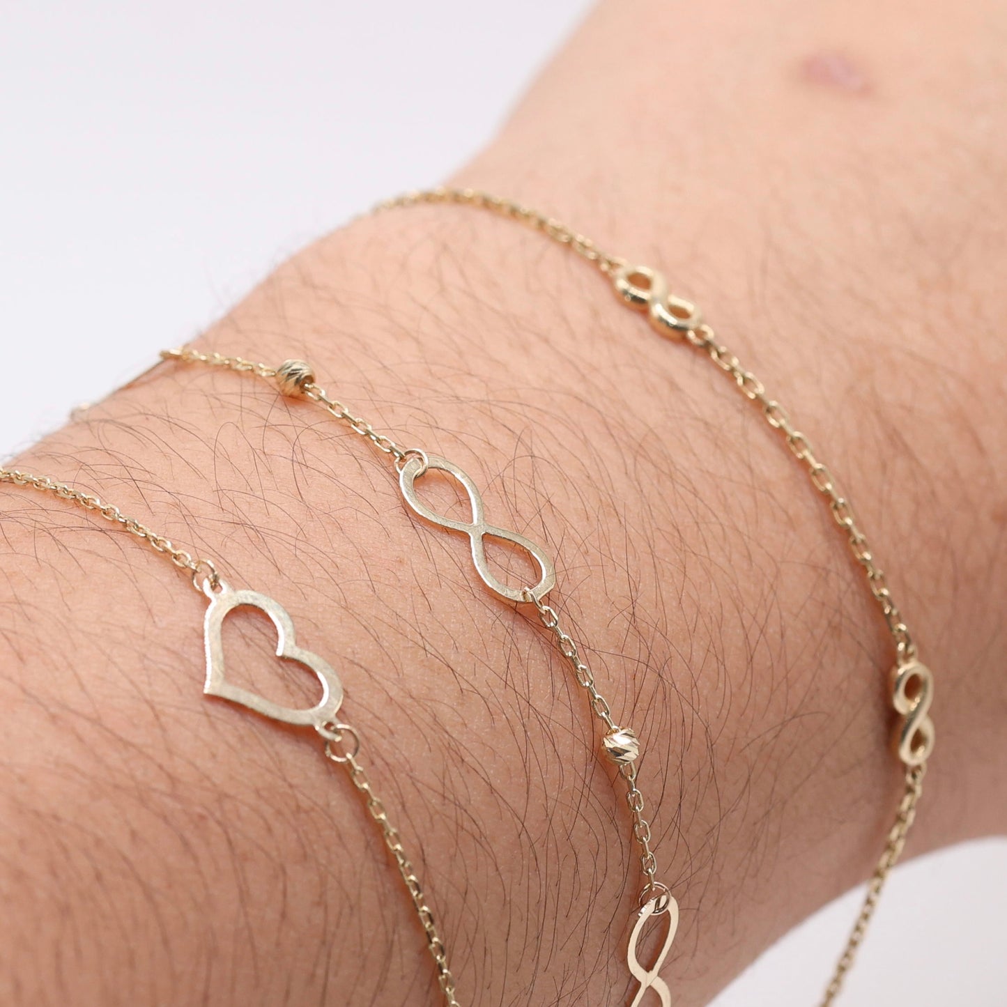 14KT GOLD INFINITY BRACELET WITH DAINTY BALLS