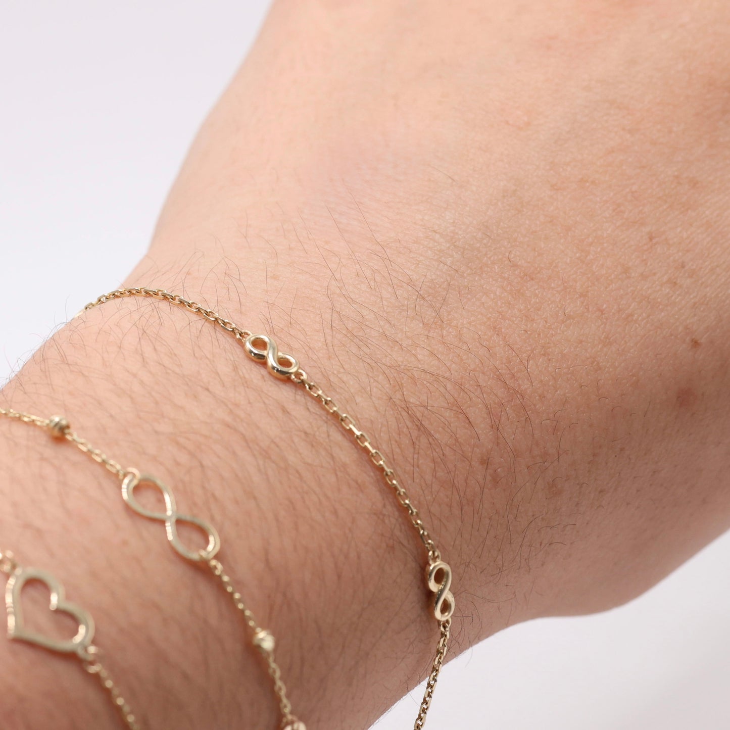 14KT GOLD 4 SMALL INFINITY BRACELET