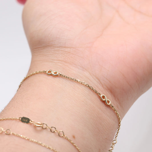 14KT GOLD 4 SMALL INFINITY BRACELET